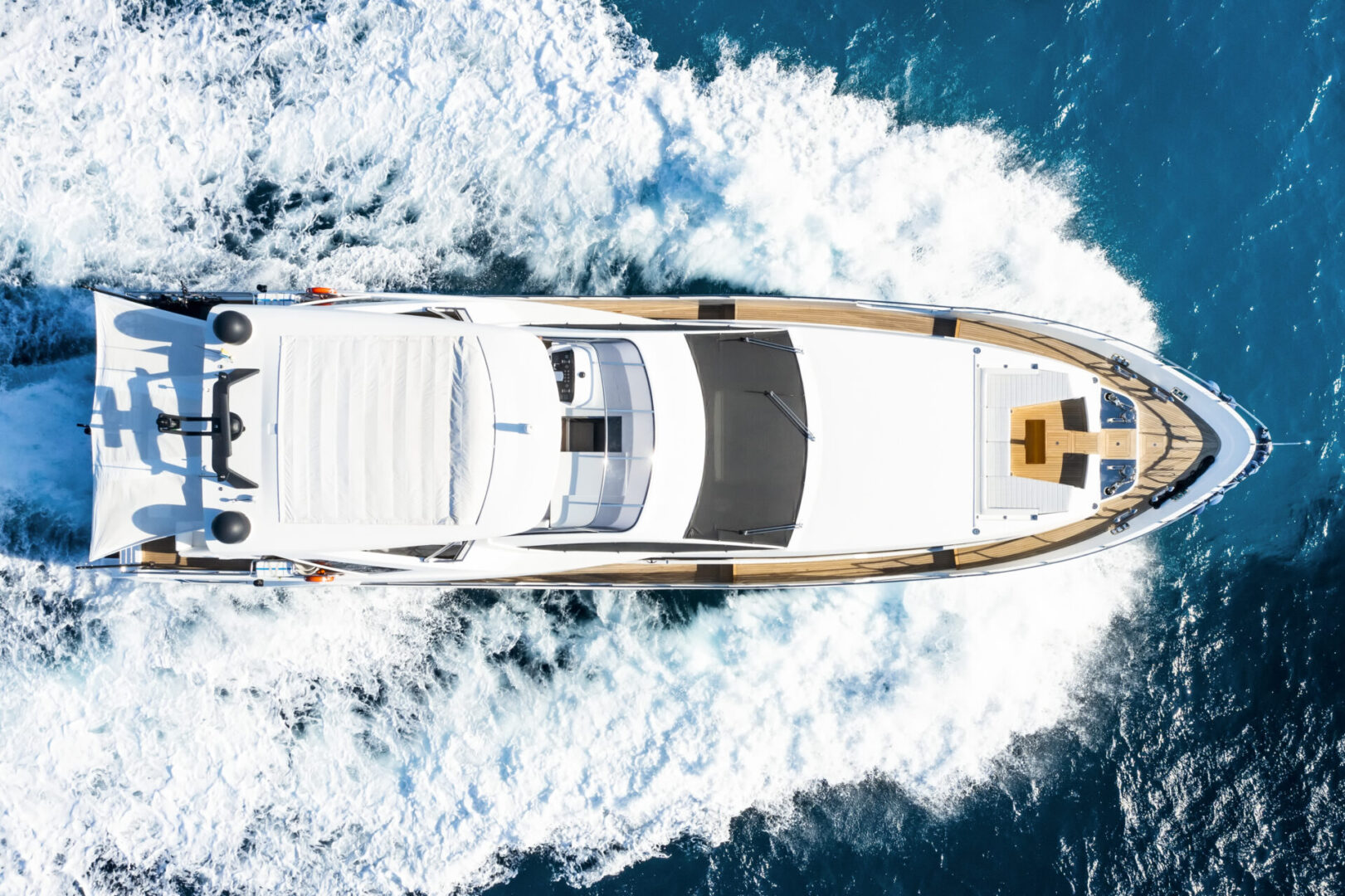 A boat is in the water and there are clouds above it.